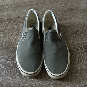 Charcoal (grey) colored slip-on vans